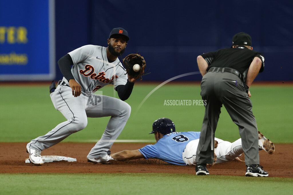 Scott Audette Tampa Bay Rays' Brandon Lowe slides safely into second base, beating the throw to Detroit Tigers shortstop Niko Goodrum during the third inning of a baseball game Sunday, Sept. 19, 2021, in St. Petersburg, Fla. (AP Photo/Scott Audette)