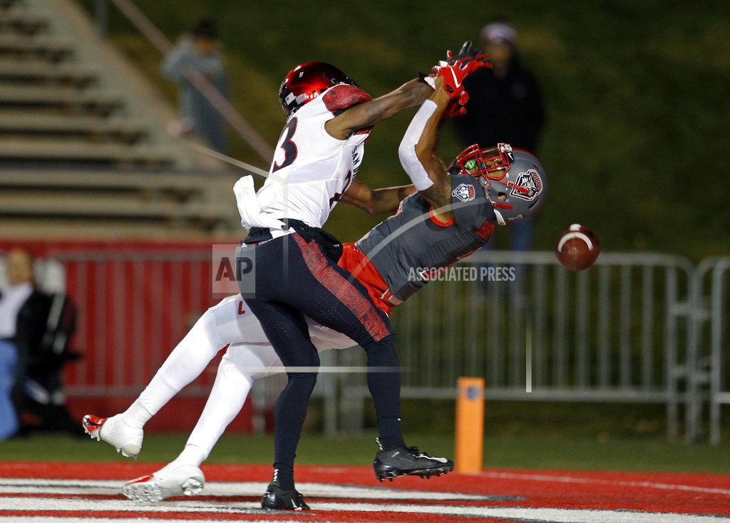 Andres Leighton San Diego State cornerback Darren Hall, left, breaks up a pass in the end zone intended for New Mexico wide receiver Delane Hart-Johnson during the first half of an NCAA college football game in Albuquerque, N.M., Saturday, Nov. 3, 2018. (AP Photo/Andres Leighton)