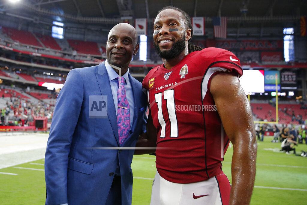 Rick Scuteri Arizona Cardinals wide receiver Larry Fitzgerald (11) poses with NFL hall of famer Jerry Rice after an NFL football game against the Seattle Seahawks, Sunday, Sept. 29, 2019, in Glendale, Ariz. (AP Photo/Rick Scuteri)