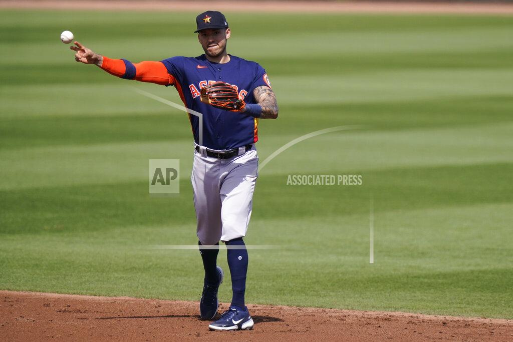 Lynne Sladky Houston Astros shortstop Carlos Correa throws Miami Marlins' Corey Dickerson out at first during the third inning of a spring training baseball game, Friday, March 5, 2021, in Jupiter, Fla. (AP Photo/Lynne Sladky)