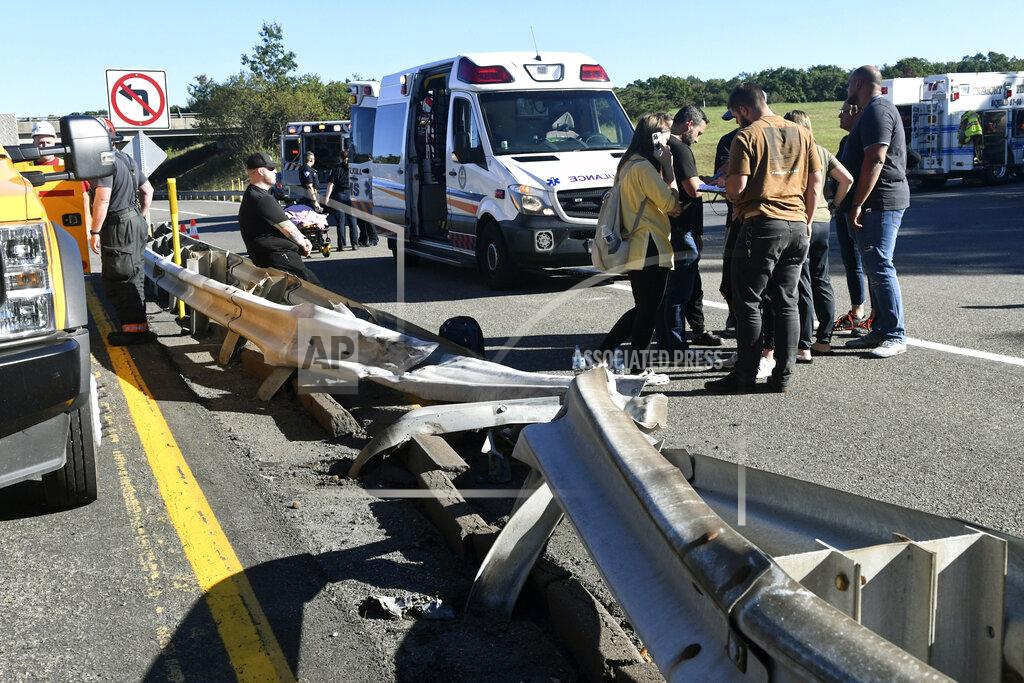 Jacqueline Dormer A damaged guardrail is seen on Rt. 25 after a Premiere #1 Limousine bus crashed into a wooded area off I-81 in Frailey Township on Sunday, Sept. 19, 2021. The bus was traveling on I-81 south and came off the Hegins exit ramp, crossing through the divider on Rt. 25 and crashed into a wooded area off Rt. 25 where it came to a stop. (Jacqueline Dormer/Republican-Herald via AP)