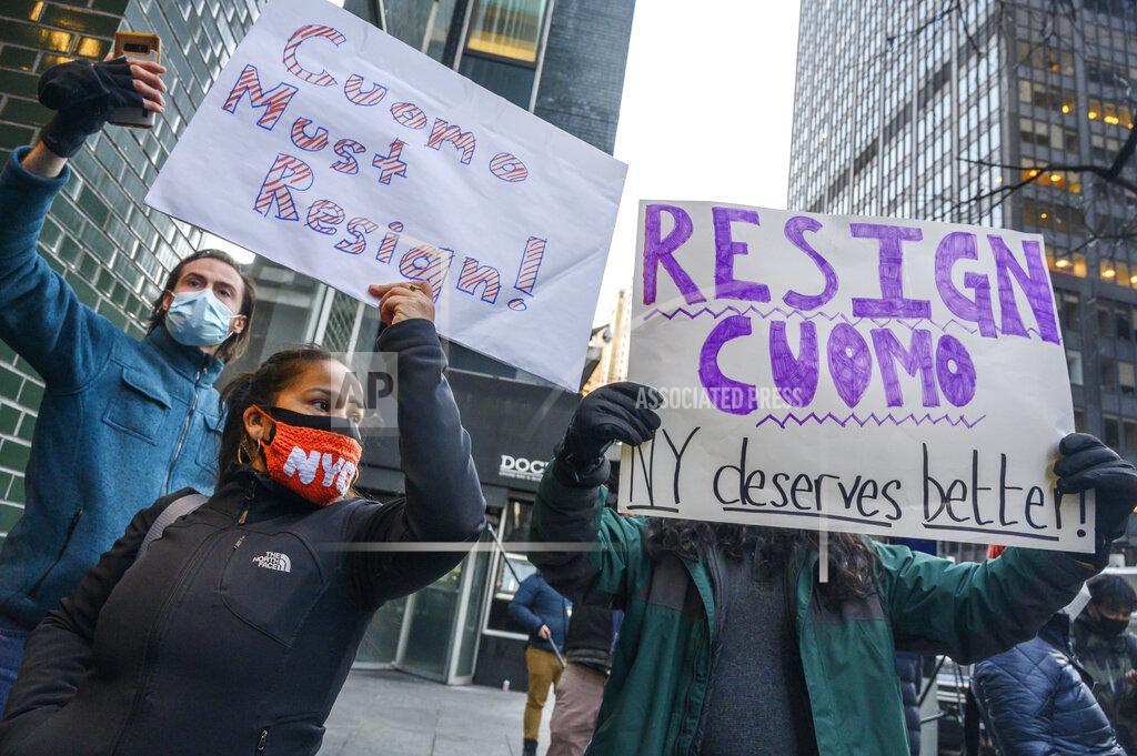 Brittainy Newman People rally for New York Gov. Andrew Cuomo's resignation in front of his Manhattan office in New York, Tuesday, March 2, 2021. Cuomo is facing calls for resignations from some members of his own party as most leading Democrats signal they want to await the results of the attorney general’s investigation into claims the governor sexually harassed aides. (AP Photo/Brittainy Newman)