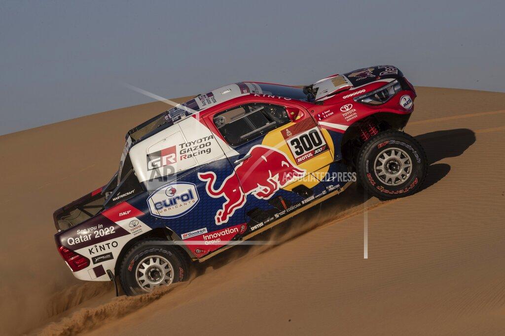 Bernat Armangue Driver Nasser Al-Attiyah, of Qatar, and co-driver Matthieu Baumel, of France, race their Toyota during stage eight of the Dakar Rally in Wadi Al Dawasir, Saudi Arabia, Monday, Jan. 13, 2020. (AP Photo/Bernat Armangue)