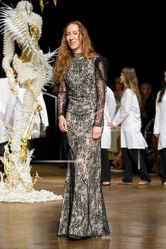 Michel Euler Designer Iris van Herpen accepts applause at the end of Iris van Herpen Haute Couture Fall/Winter 2022-2023 fashion collection presented Monday, July 4, 2022 in Paris. (AP Photo/Michel Euler)