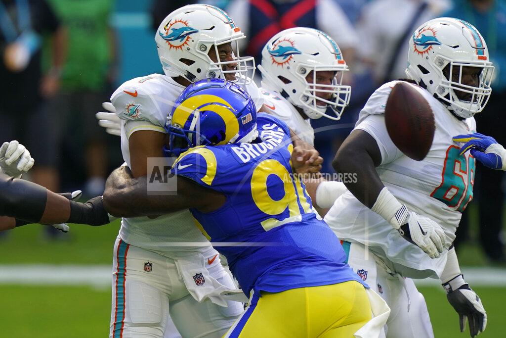 Lynne Sladky Los Angeles Rams defensive end Michael Brockers (90) hits Miami Dolphins quarterback Tua Tagovailoa (1) that causes Tagavailoa to fumble the ball, during the first half of an NFL football game, Sunday, Nov. 1, 2020, in Miami Gardens, Fla. (AP Photo/Lynne Sladky)