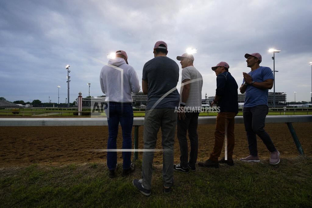 Charlie Riedel Former college teammates from left to right, Eric Armagost, Alex Quoyeser, Reiley Higgins, Patrick O'Neill and Dan Giovacchini, wait to watch Kentucky Derby entrant Hot Rod Charlie workout at Churchill Downs Wednesday, April 28, 2021, in Louisville, Ky. The group own 25% of the horse being trained by O'Neill's uncle Doug O'Neill. (AP Photo/Charlie Riedel)