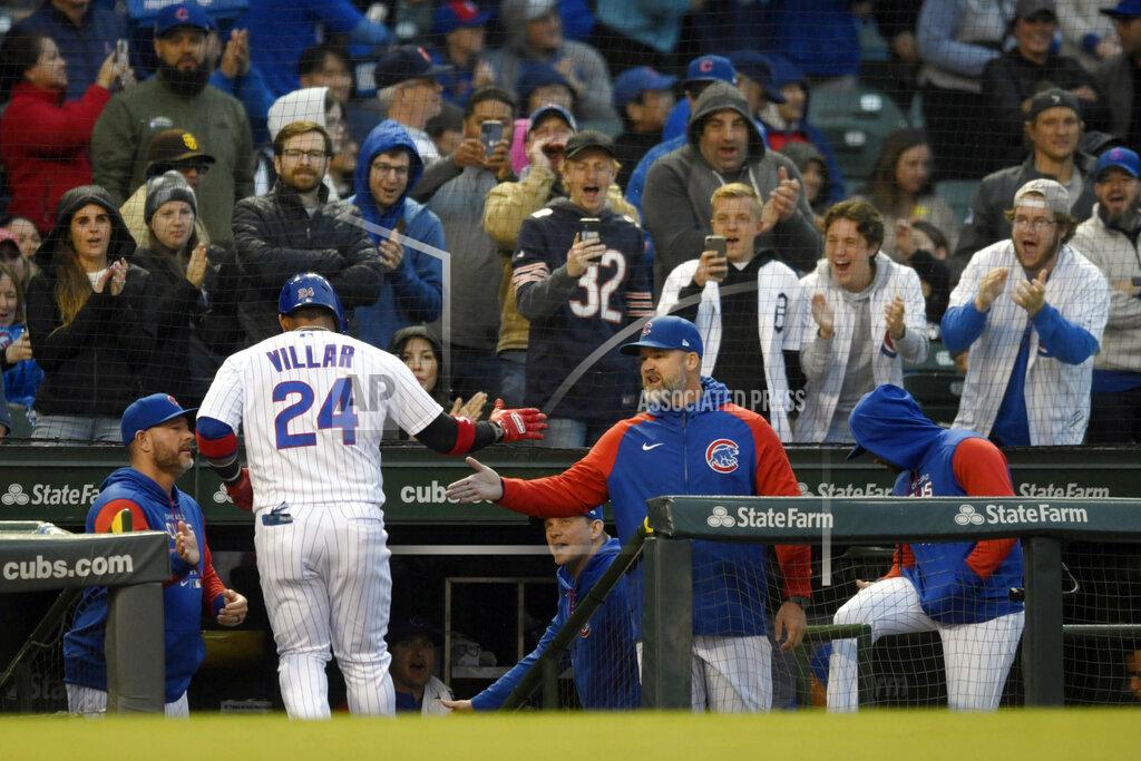 Paul Beaty Chicago Cubs' Jonathan Villar (24) celebrates with manager David Ross right, at the dugout after hitting a solo home run during the third inning of a baseball game against the Pittsburgh Pirates Tuesday, May 17, 2022, in Chicago. (AP Photo/Paul Beaty)