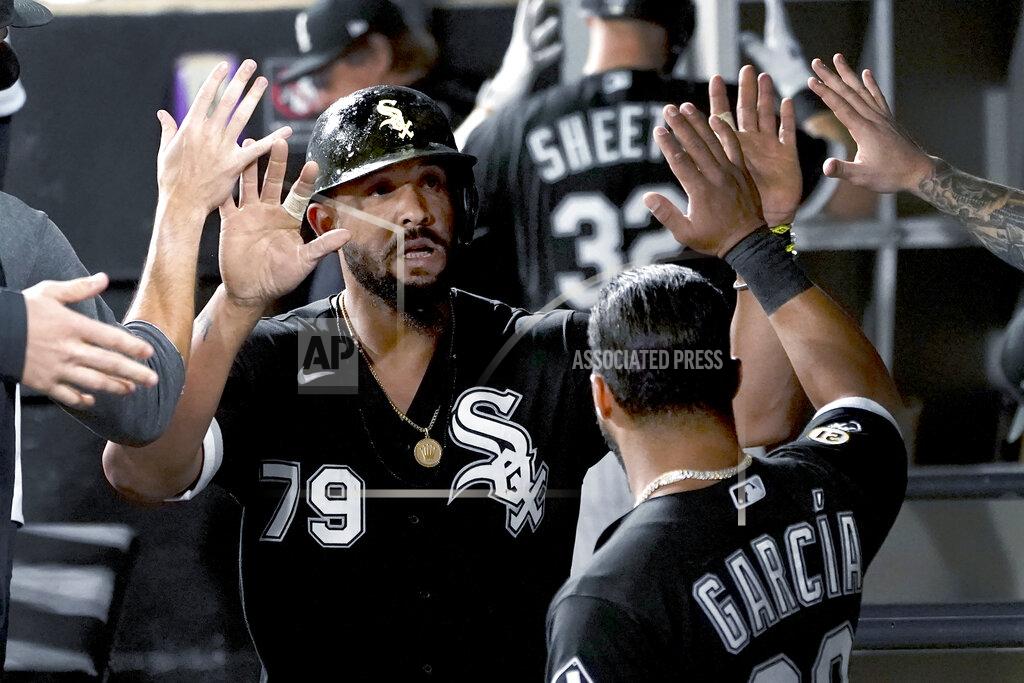 Charles Rex Arbogast Chicago White Sox's Jose Abreu is congratulated in the dugout after scoring on a single by Yasmani Grandal during the sixth inning of the team's baseball game against the Los Angeles Angels on Wednesday, Sept. 15, 2021, in Chicago. (AP Photo/Charles Rex Arbogast)