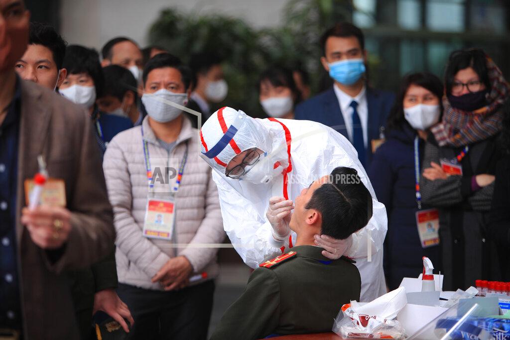 Hau Dinh FILE - In this Friday, Jan. 29, 2021 file photo, a health worker takes swab samples of a security officer to test for COVID-19 at the venue of Vietnam Communist Party congress in Hanoi, Vietnam. On Friday, The Associated Press reported on stories circulating online incorrectly asserting the World Health Organization admits that PCR tests to diagnose COVID-19 gave massive false positives, overinflating COVID-19 case numbers. WHO told The Associated Press that it has received 10 reports of problems related to PCR tests for the detection of SARS-CoV-2. “The reports were for misdiagnosis, both false positive and false negative results,” according to WHO. (AP Photo/Hau Dinh)