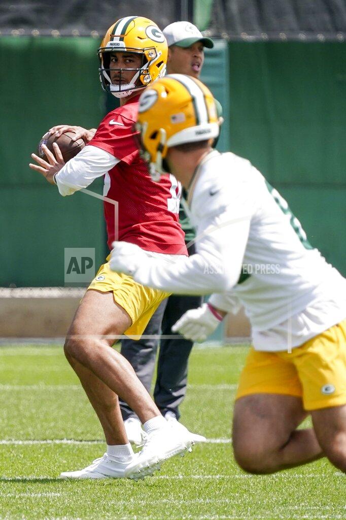 Morry Gash Green Bay Packers' Jordan Love runs a drill at the NFL football team's practice field training camp Tuesday, May 24, 2022, in Green Bay, Wis. (AP Photo/Morry Gash)