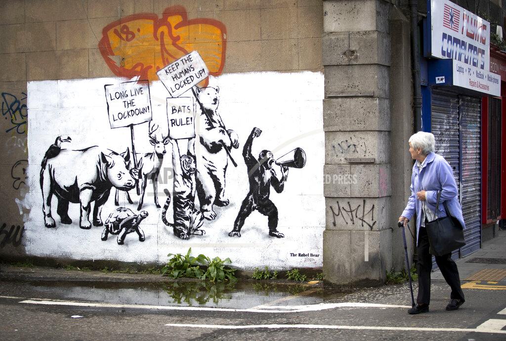 Jane Barlow A new piece of street art by The Rebel Bear has appeared on a wall in Leith, Scotland, as Scotland is moving into phase one of the Scottish Government's plan for gradually lifting lockdown, Wednesday June 3, 2020. Scotland and Wales have developed separate procedures from England to gradually allow the lifting of lockdown restrictions because of the COVID-19 coronavirus. (Jane Barlow/PA via AP)