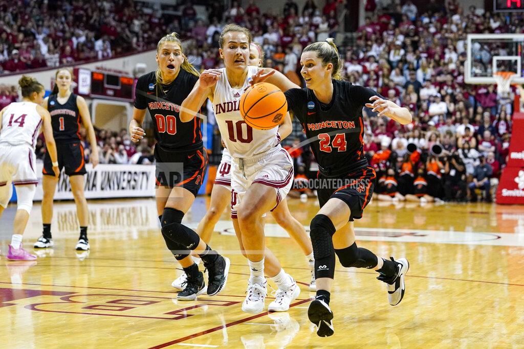 Michael Conroy Princeton guard Julia Cunningham (24) drives on Indiana forward Aleksa Gulbe (10) in the first half of a college basketball game in the second round of the NCAA tournament in Bloomington, Ind., Monday, March 21, 2022. (AP Photo/Michael Conroy)