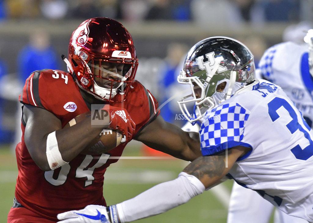 Timothy D. Easley Kentucky linebacker Jordan Jones (34) tries to tackle Louisville running back Jeremy Smith (34) during the second half of an NCAA college football game in Louisville, Ky., Saturday, Nov. 24, 2018. (AP Photo/Timothy D. Easley)