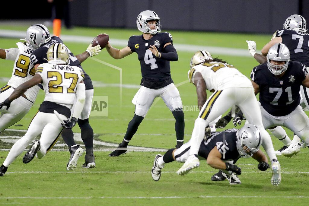 Isaac Brekken Las Vegas Raiders quarterback Derek Carr (4) throws against the New Orleans Saints during the second half of an NFL football game, Monday, Sept. 21, 2020, in Las Vegas. (AP Photo/Isaac Brekken)