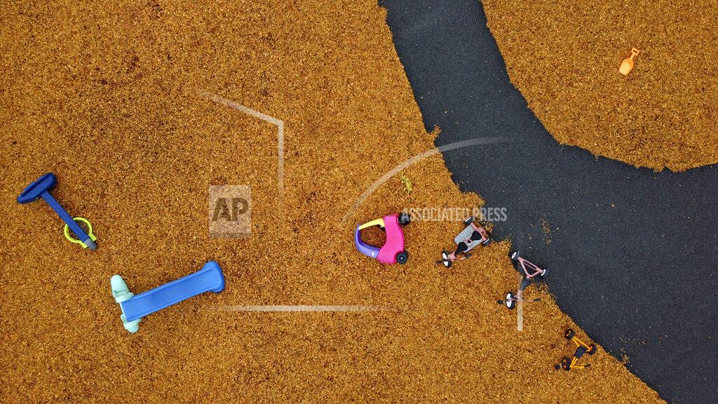 David Goldman Toys lie scattered on an empty playground outside a school closed to stop the spread of coronavirus, Monday, March 30, 2020, in Attleboro, Mass. It's a scene playing out all over the world. The empty streets, the lone commuter and the silent playgrounds. (AP Photo/David Goldman)