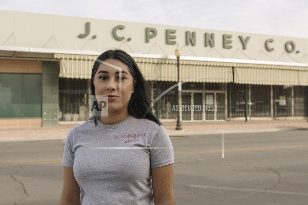 Madeline Tolle Alexandra Orozco stands for a portrait outside of the closed J.C. Penney where she was laid off from, in Delano, Calif., on Sunday, Dec. 6, 2020. Orozco began working part-time at the department store when she was 18, and in nearly four years rose through the ranks from cashier to freight team associate. (Madeline Tolle/The Fuller Project via AP)