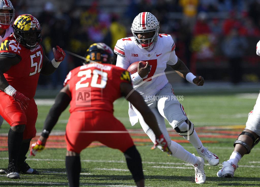 Nick Wass Ohio State quarterback Dwayne Haskins Jr. (7) runs with the ball against Maryland defensive back Antwaine Richardson (20) and defensive lineman Oluwaseun Oluwatimi (52) during the first half of an NCAA football game, Saturday, Nov. 17, 2018, in College Park, Md. (AP Photo/Nick Wass)