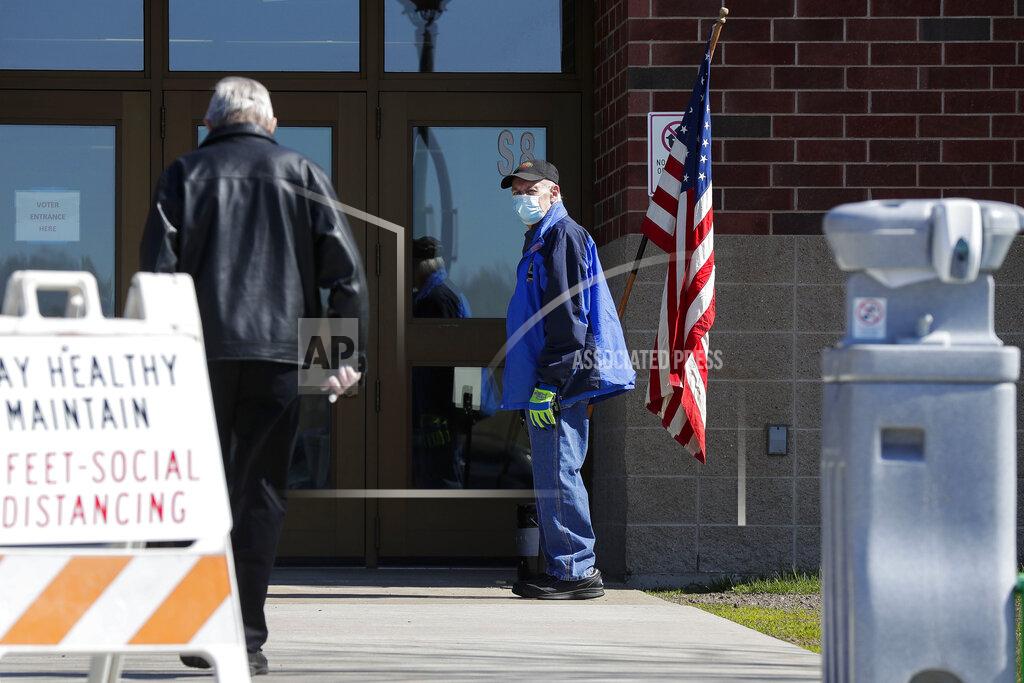 Tork Mason Voters make their way into the polling place to vote during a special election for Wisconsin's 7th Congressional District on Tuesday, May 12, 2020, at Wausau East High School in Wausau, Wis. Republican Tom Tiffany and Democrat Tricia Zunker are vying to fill the vacancy left by Republican Sean Duffy, who resigned from the seat in September. (Tork Mason/The Post-Crescent via AP)