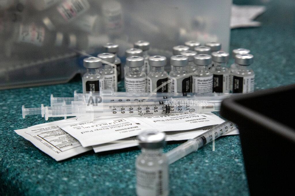 Doses of the Pfizer coronavirus vaccine are seen being prepared on Wednesday, May 12, 2021, in Decatur, Ga. Hundreds of children, ages 12 to 15, received the Pfizer vaccine at the DeKalb Pediatric Center, just days after it was approved for use within their age group. (AP Photo/Ron Harris)