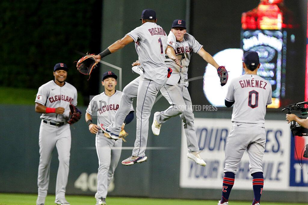 Andy Clayton-King Cleveland Guardians' Amed Rosario (1) and Myles Straw jump between Oscar Gonzalez, left, Steven Kwan and Andres Gimenez (0) after the Guardians defeated the Minnesota Twins in a baseball game Wednesday, June 22, 2022, in Minneapolis. (AP Photo/Andy Clayton-King)