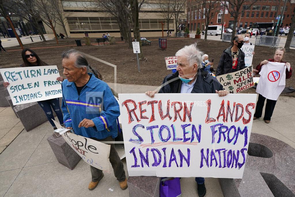 Tony Dejak Protesters gather before a baseball game between the Kansas City Royals and the Cleveland Indians, Monday, April 5, 2021, in Cleveland. (AP Photo/Tony Dejak)