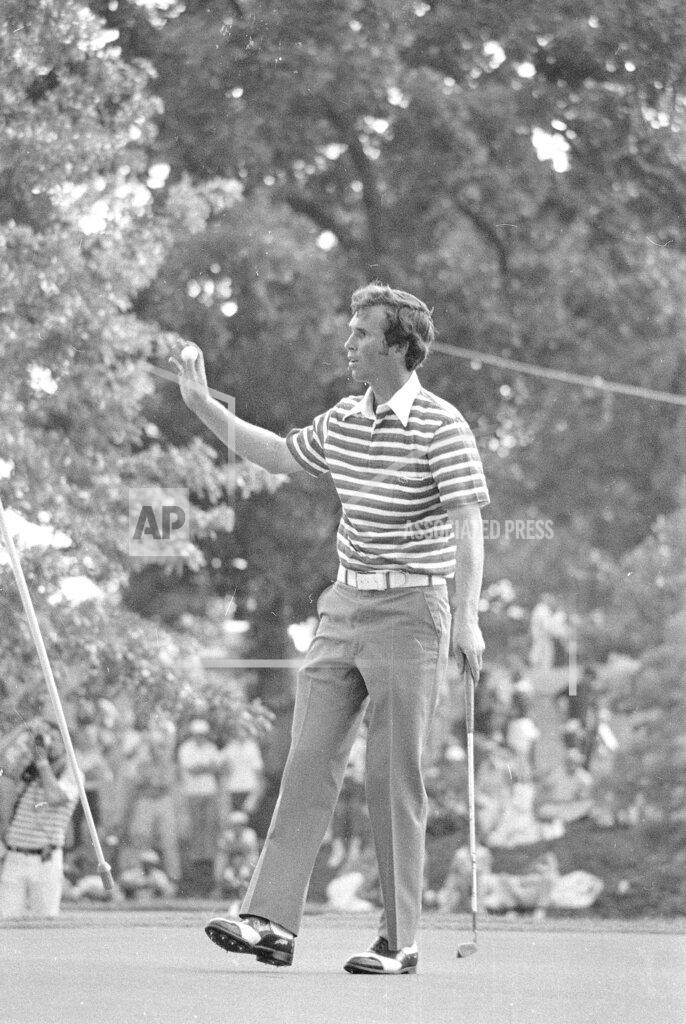 Uncredited FILE - Hubert Green waves to spectators after holing out to win the U.S. Open Championship golf tournament at Southern Hills Country Club in Tulsa, Okla., on June 19, 1977. Green won despite police investigating a death threat against him in the final round.(AP Photo/File)