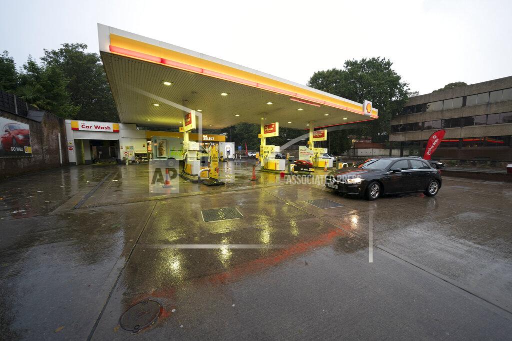 Jon Super A car drives through the forecourt of a petrol station in Manchester which has run out of fuel after an outbreak of panic buying in the UK, Monday, Sept. 27, 2021. British Prime Minister Boris Johnson is said to be considering whether to call in the army to deliver fuel to petrol stations as pumps ran dry after days of panic buying. (AP Photo/Jon Super)