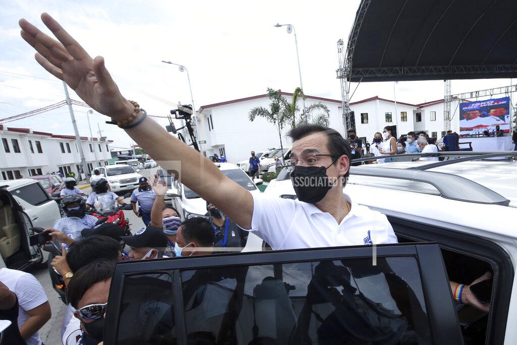 Uncredited Manila Mayor Isko Moreno waves after he declared his bid to run for president in a speech at a public school in the slum area near the place where he grew up in Manila, Philippines on Wednesday Sept. 22, 2021. The popular mayor of the Philippine capital said Wednesday he will run for president in next year's elections, the latest aspirant in what is expected to be a crowded race to succeed the controversial Rodrigo Duterte. (AP Photo)