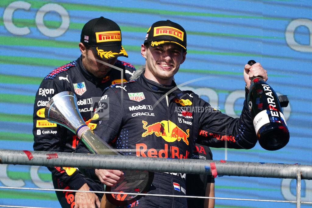 Darron Cummings Red Bull driver Max Verstappen, front, of the Netherlands, celebrates after winning the Formula One U.S. Grand Prix auto race at Circuit of the Americas, Sunday, Oct. 24, 2021, in Austin, Texas. (AP Photo/Darron Cummings)