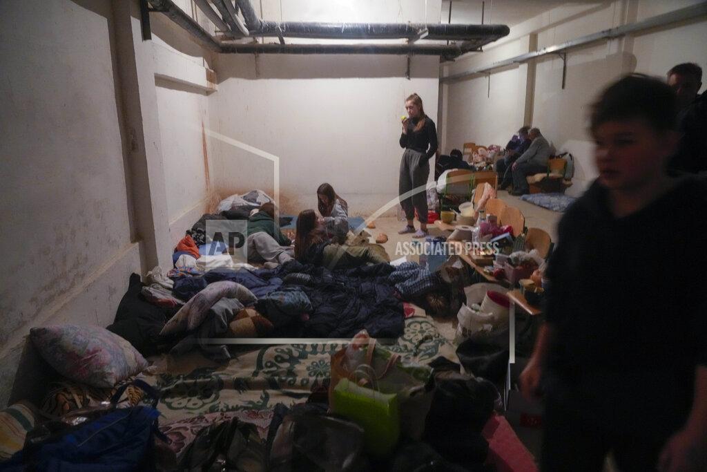 Efrem Lukatsky FILE - People shelter from Russian artillery shelling in a school basement in the village of Horenka close to Kyiv, Ukraine, Sunday, March 6, 2022. (AP Photo/Efrem Lukatsky, File)