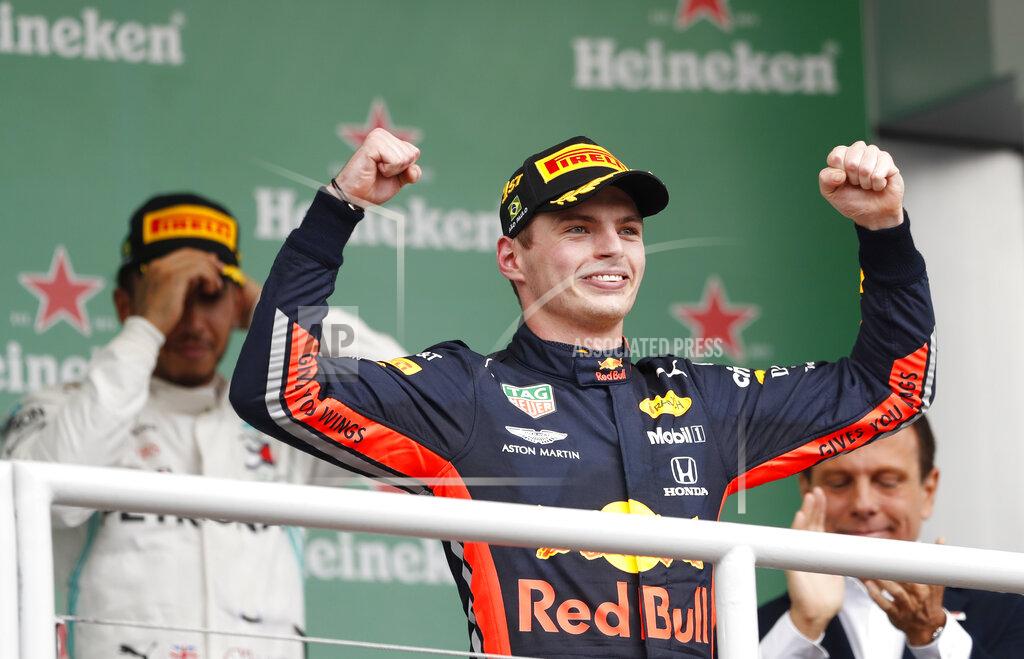 Nelson Antoine Red Bull driver Max Verstappen, of the Netherlands,center, celebrates at the podium after winning the Brazilian Formula One Grand Prix at the Interlagos race track in Sao Paulo, Brazil, Sunday, Nov. 17, 2019. (AP Photo/Nelson Antoine)