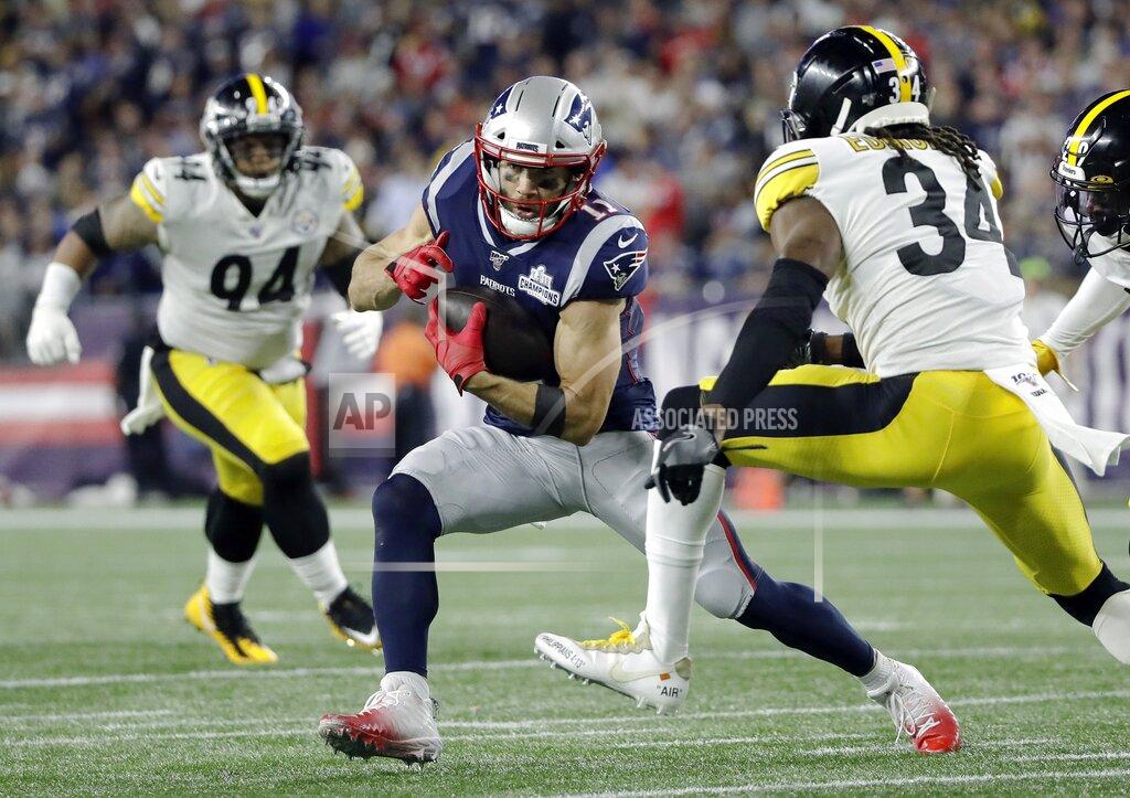 Elise Amendola New England Patriots wide receiver Julian Edelman, center, runs from Pittsburgh Steelers strong safety Terrell Edmunds (34) after catching a pass in the first half an NFL football game, Sunday, Sept. 8, 2019, in Foxborough, Mass. (AP Photo/Elise Amendola)
