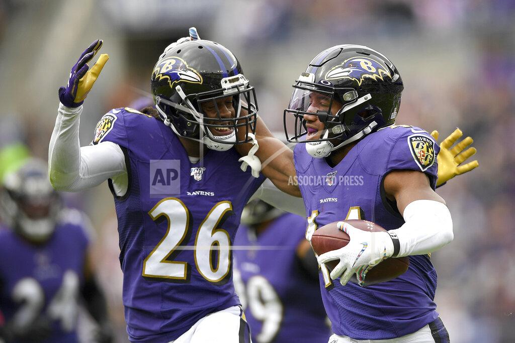 Nick Wass Baltimore Ravens cornerback Marlon Humphrey, right, celebrates his interception off a pass from Cincinnati Bengals quarterback Andy Dalton with teammate cornerback Maurice Canady (26) during the first half of a NFL football game Sunday, Oct. 13, 2019, in Baltimore. (AP Photo/Nick Wass)