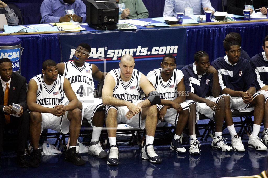 Lawrence Jackson FILE - In this March 26, 2006, file photo, dejected Connecticut players watch near the end of overtime in a game against George Mason during the fourth round of the NCAA college basketball tournament in Washington. George Mason defeated Connecticut, 86-84 to advance to the Final Four. (AP Photo/Lawrence Jackson, File)