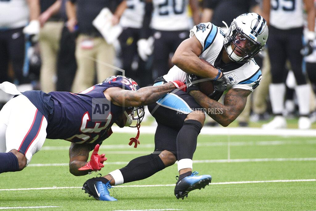 Eric Christian Smith Carolina Panthers wide receiver D.J. Moore (12) runs past Houston Texans cornerback Lonnie Johnson (32) after a catch during the first half of an NFL football game Sunday, Sept. 29, 2019, in Houston. (AP Photo/Eric Christian Smith)