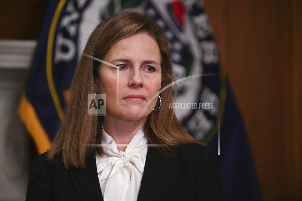 Erin Scott FILE - In this Oct. 1, 2020, file photo Supreme Court nominee Judge Amy Coney Barrett, meets with Sen. Joni Ernst, R-Iowa, at the Capitol in Washington. Hearings before the Republican-led Senate Judiciary Committee will begin Monday, Oct. 12, for Barrett. (Erin Scott/Pool via AP, File)