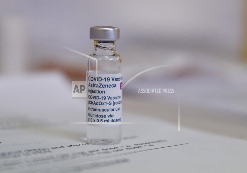 Alastair Grant A vial of the AstraZeneca COVID-19 vaccine ready for use at the Wheatfield surgery in Luton, England, Thursday, March 18, 2021. The world is awaiting the results of an initial European investigation into whether there is any evidence that the AstraZeneca coronavirus vaccine was behind unusual blood clots reported in some recipients of the shot. (AP Photo/Alastair Grant)