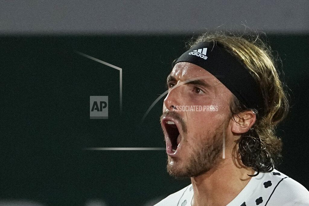 Michel Euler Greece's Stefanos Tsitsipas shouts as he defeats Zdenek Kolar of the Czech Republic during their second round match of the French Open tennis tournament at the Roland Garros stadium Thursday, May 26, 2022 in Paris. (AP Photo/Michel Euler)