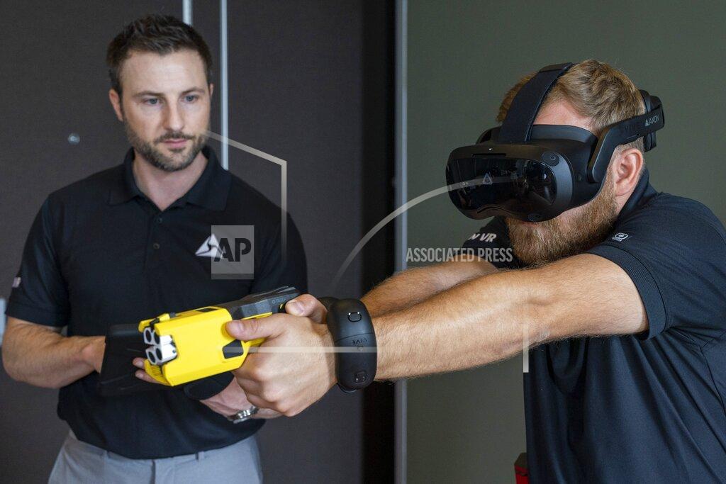 Jacquelyn Martin VR equipment and a version of the TASER 7 that utilizes VR technology for training, is demonstrated, Thursday, May 12, 2022, in Washington. (AP Photo/Jacquelyn Martin)