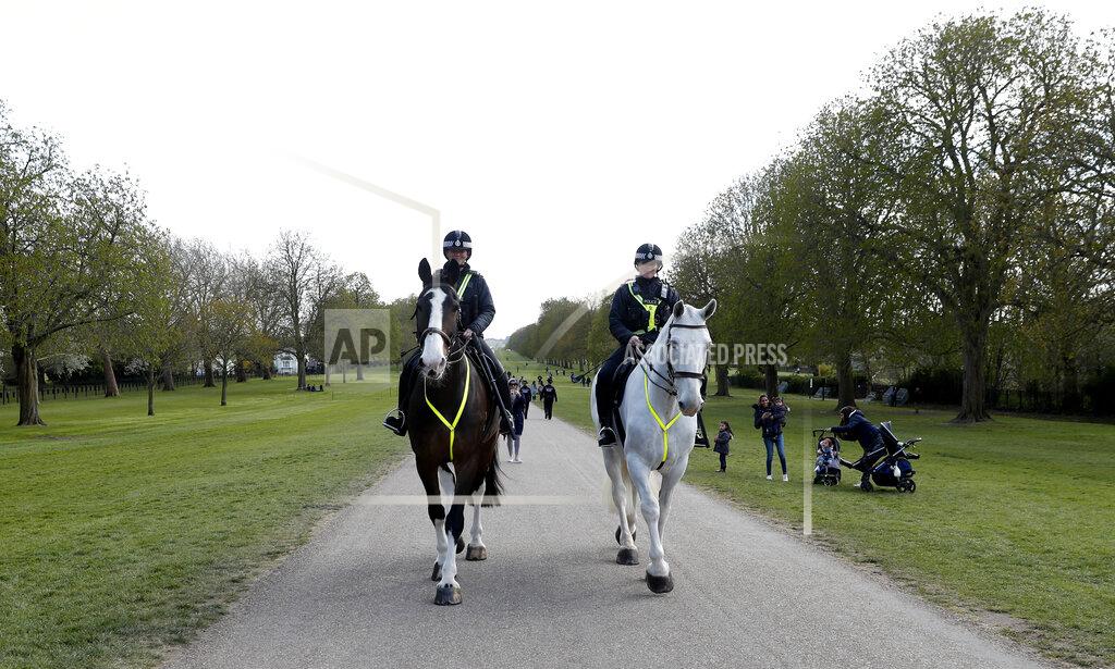 Alastair Grant Mounted police ride along the Long Walk as they patrol round Window castle in Windsor, England, Friday, April 16, 2021. Prince Philip husband of Britain's Queen Elizabeth II died April 9, aged 99, his funeral will take place Saturday at Windsor Castle in St George's Chapel. (AP Photo/Alastair Grant)