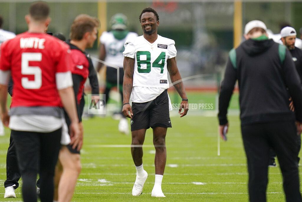 New York Jets' Corey Davis smiles while participating in a drill at the NFL football team's training facility in Florham Park, N.J., Tuesday, May 24, 2022. (AP Photo/Seth Wenig)