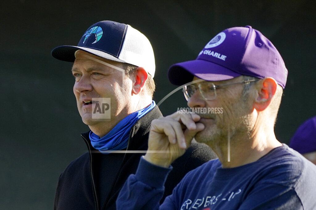 Charlie Riedel Trainer Doug O'Neill, left, and Bill Strauss, co-owner of Kentucky Derby hopeful Hot Rod Charlie, talk outside their barn after a workout at Churchill Downs Tuesday, April 27, 2021, in Louisville, Ky. The 147th running of the Kentucky Derby is scheduled for Saturday, May 1. (AP Photo/Charlie Riedel)