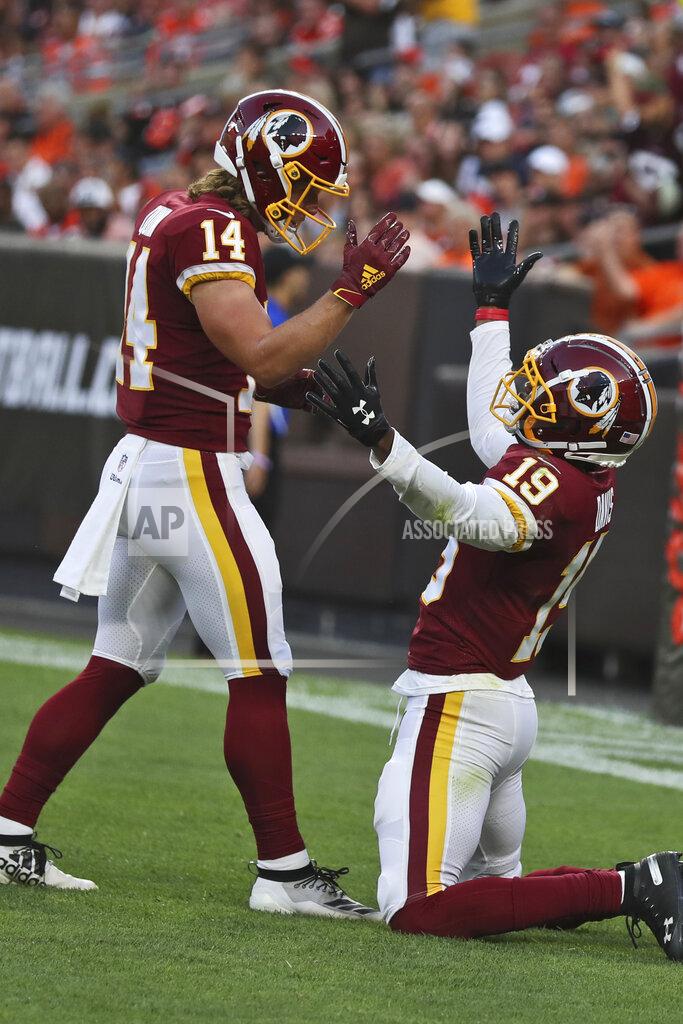 Ron Schwane Washington Redskins wide receiver Robert Davis (19) celebrates with wide receiver Trey Quinn (14) after Davis scored a 46-yard touchdown during the first half of the team's NFL preseason football game against the Cleveland Browns, Thursday, Aug. 8, 2019, in Cleveland. (AP Photo/Ron Schwane)