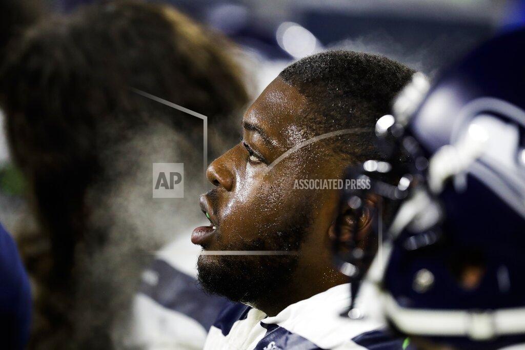 Darron Cummings Seattle Seahawks' Jamarco Jones is seen on the bench during the first half of an NFL divisional playoff football game against the Green Bay Packers Sunday, Jan. 12, 2020, in Green Bay, Wis. (AP Photo/Darron Cummings)