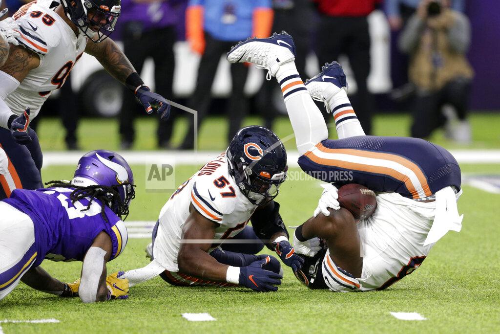 Andy Clayton-King Chicago Bears defensive tackle Bilal Nichols, right, and linebacker Kevin Pierre-Louis (57) recover a fumble by Minnesota Vikings running back Mike Boone, left, during the first half of an NFL football game, Sunday, Dec. 29, 2019, in Minneapolis. (AP Photo/Andy Clayton-King)