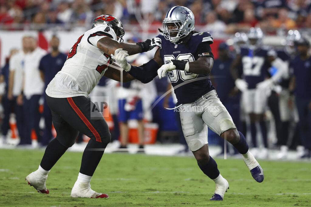 Mark Lomoglio FILE - Dallas Cowboys defensive end DeMarcus Lawrence (90) works around Tampa Bay Buccaneers offensive tackle Tristan Wirfs (78) during the second half of an NFL football game Sept. 9, 2021, in Tampa, Fla. “Being a Cowboy for life is always a dream,” Lawrence said Thursday, March 24, 2022, in his first comments to reporters since signing a new $40 million, three-year contract with $30 million guaranteed. “There's no reason why I go against my dreams." (AP Photo/Mark LoMoglio, File)