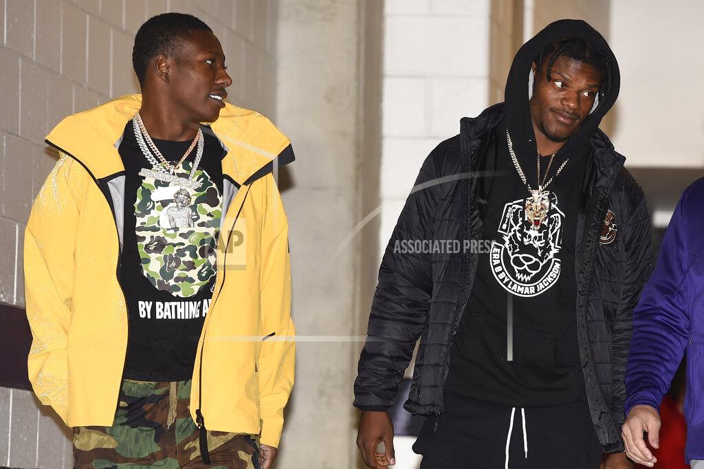 Gail Burton Baltimore Ravens quarterback Lamar Jackson, right, and wide receiver Marquise Brown, left, arriving before the start of an NFL football game against the San Francisco 49ers, Sunday, Dec. 1, 2019, in Baltimore, Md. (AP Photo/Gail Burton)
