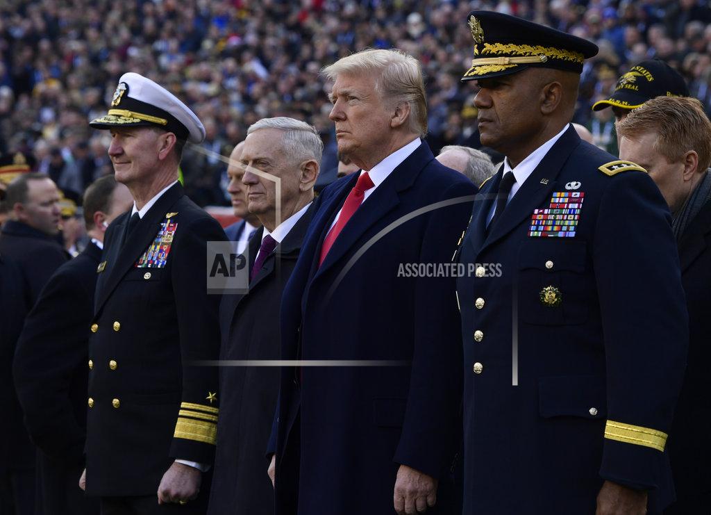 Susan Walsh President Donald Trump, center, stands with Defense Secretary Jim Mattis, second from left, during pregame ceremonies at the Army-Navy NCAA college football game in Philadelphia, Saturday, Dec. 8, 2018. (AP Photo/Susan Walsh)