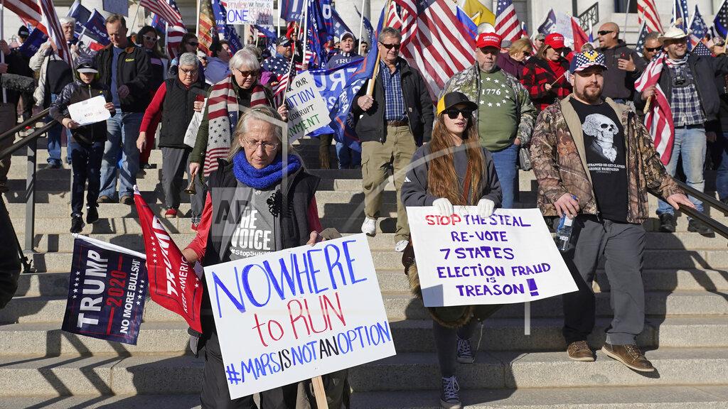 Rick Bowmer FILE - In this Jan. 6, 2021 file photo, supporters of President Donald Trump attend a rally in protest of President-elect Joe Biden election win, in Salt Lake City. Statehouses where Trump loyalists have rallied since the Nov. 3 election are heightening security after the storming of the U.S. Capitol this week. Police agencies in a number of states are monitoring threats of violence as legislatures return to session and as the nation prepares for the inauguration of President-elect Joe Biden. (AP Photo/Rick Bowmer, File)