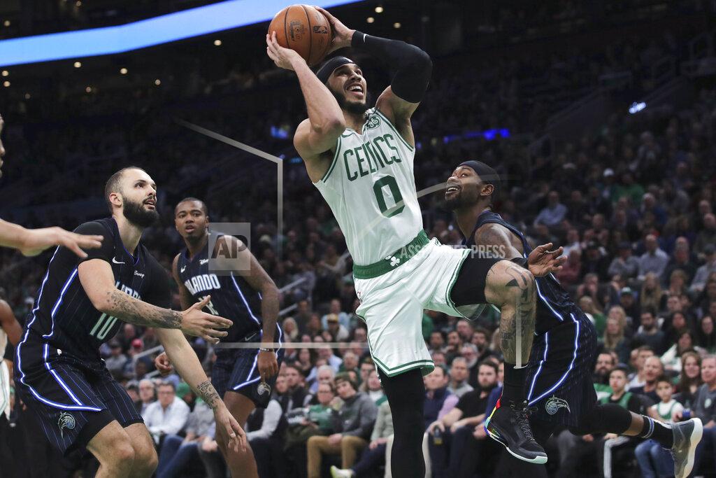 Boston Celtics forward Jayson Tatum (0) drives to the basket against the Orlando Magic during the second quarter of an NBA basketball game in Boston, Wednesday, Feb. 5, 2020. (AP Photo/Charles Krupa)